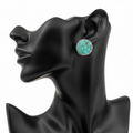 Turquoise Round Bezel Stud Earrings on Black Mannequin Ear